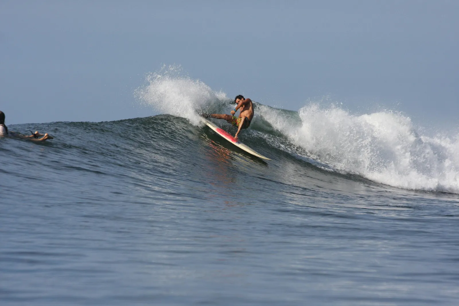 Long Salvadorean point break peeling down a cobblestone reef.