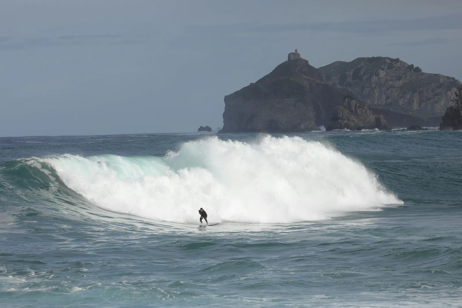 Northern Spanish beach break with offshore wind and a clean A-frame.